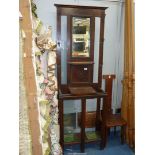 An Oak Hall Stand having a bevelled mirror and a glove compartment,