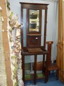 An Oak Hall Stand having a bevelled mirror and a glove compartment,
