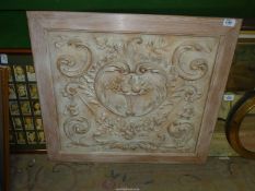 A framed Plaster Panel decorated with floral swags and scrolls with a central feature of fruits in