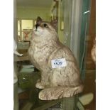 A Royal Doulton cream Persian cat having green eyes 8 1/2" tall.