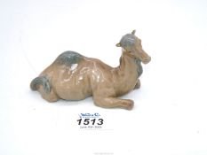 A figure of a lying down Camel.