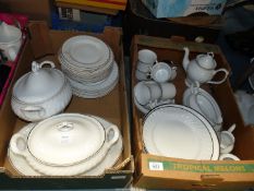 Two boxes of white china dinner and tea ware including some pieces marked Romania.