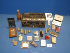 A quantity of cigarette lighters including Ronson, Paola of London, match-holders, etc.