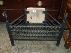 A wrought iron fire grate.