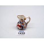 A fine and rare early 19th century miniature porcelain hydra jug, the base marked 'Spode',