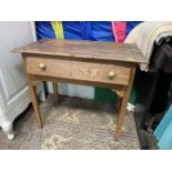 A mid oak Side Table standing on tapering square legs and having frieze drawer with brass knob