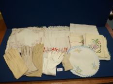 A quantity of vintage table linen and gloves.