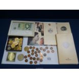 A quantity of coins to include; Churchill crown, Golden Wedding crown,