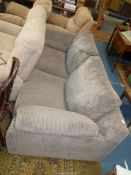 A modern dark beige cord pattern upholstered 2/3 seater settee.