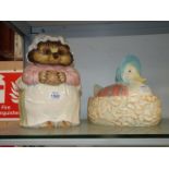 A Beatrix Potter Mrs Tiggy Winkle cookie jar and Jemima Puddle duck egg basket.