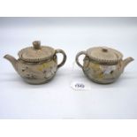 A pair of Japanese Banko style Teapots in grey ground with Crane detail,