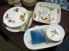 A quantity of Royal Worcester 'Evesham' china including; dinner and side plates, dessert dishes,