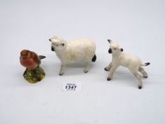 Three Beswick figures bird, sheep (crazed) and lamb, all approx. 2 3/4" tall.