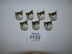 Seven Louis Wain ceramic cat buttons.