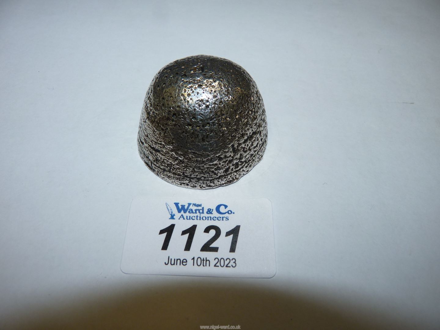 A domed silver Chinese ingot, with two panel marks to underside, 184 grams, 1 1/2".