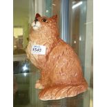 A large Beswick figure of a Ginger cat having orange eyes.