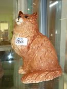 A large Beswick figure of a Ginger cat having orange eyes.