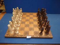 A Chess set having Oriental style pieces.