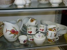A quantity of Royal Worcester 'Evesham Vale' to include flan dish, vegetable dish, tea cups,
