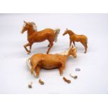A Beswick Palomino Horse and Foal together with another Palomino Horse a/f.