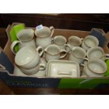 A quantity of Denby china including milk jugs, coffee and breakfast cups, saucers, cheese dish, etc.