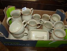 A quantity of Denby china including milk jugs, coffee and breakfast cups, saucers, cheese dish, etc.