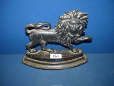 A well detailed early Victorian cast iron door stop in the form of a standing lion,