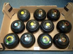 Two sets and three odd black Lawn Bowls including Hemselite Supergrip, Size 6, heavyweight model,