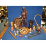 A large quantity of Treen including carved figures, bowls, plates, painted animals, eggs, etc.