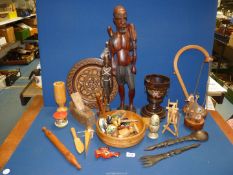 A large quantity of Treen including carved figures, bowls, plates, painted animals, eggs, etc.