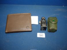 A miniature Coronet spy camera in green case and a brown leather wallet in Tommy Hilfiger box.
