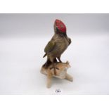 A Goebel Green Woodpecker, dated 1975, 10 1/2" tall.