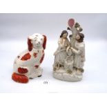 A Staffordshire flatback figural group of a man and woman standing by an urn,