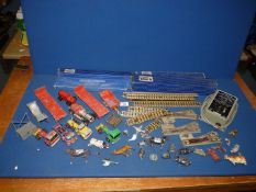 A quantity of Hornby Dublo rail track, points etc and diecast model cars and trucks, Britain's etc.