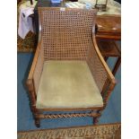 A Mahogany/Satinwood framed elegant Elbow Chair having caned back and side panels,