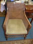 A Mahogany/Satinwood framed elegant Elbow Chair having caned back and side panels,