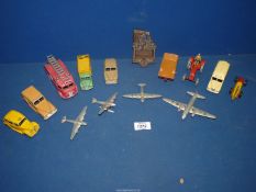 A box of 13 Dinky cars and planes including; Fire Engine, Dodge truck, Vanguard, etc.