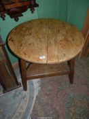 An Oak based, circular Pine topped Cricket Table,
