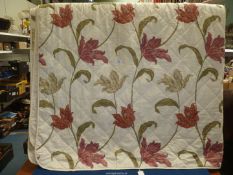 A contemporary double Throw with white and pink Lily design.