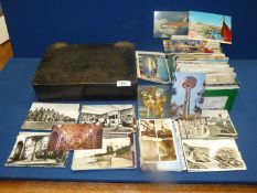 A quantity of Postcards; some black and white and some used,