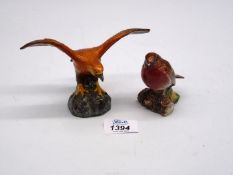 A Beswick Robin 980 and a Golden American Eagle.