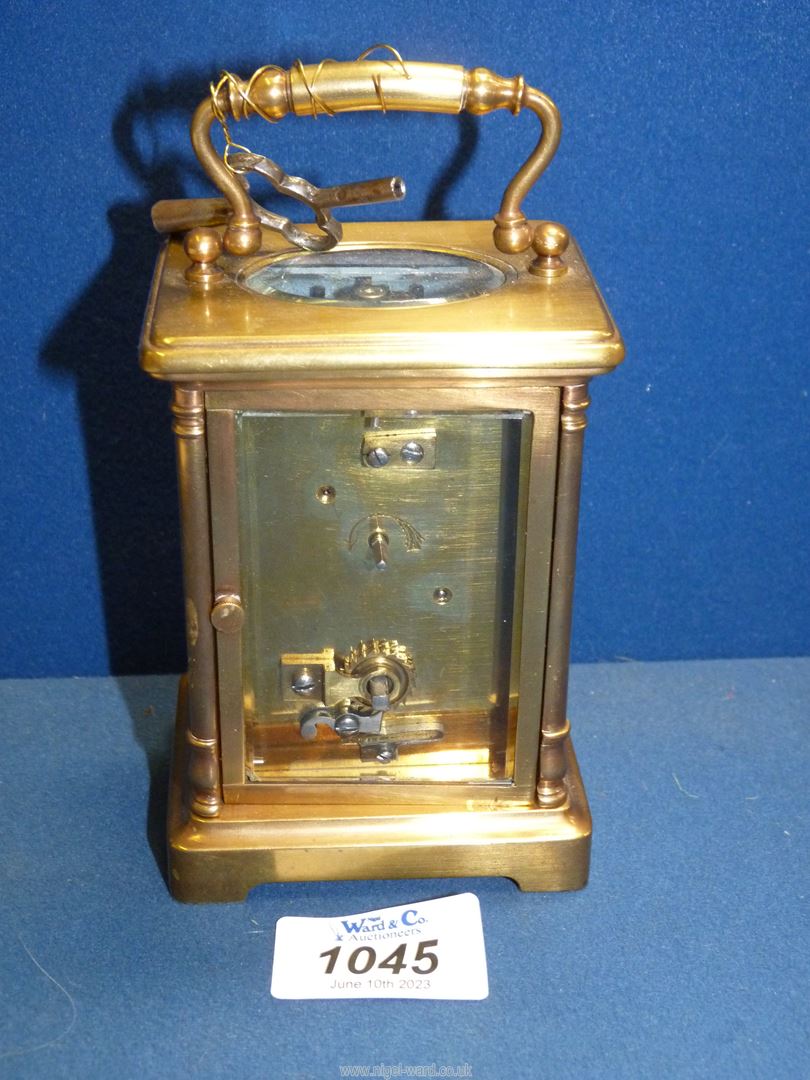 A Brass Carriage clock with Roman numerals and bevelled glass, - Image 3 of 3