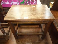 A dark Oak rectangular Occasional Table having curved corners and standing on square legs with