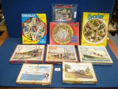 Nine vintage jigsaw puzzles including; wooden, circular, transport, etc.