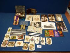 An old money box and contents including badges for Lilliput Collectors Club, St.