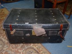 A leather bound trunk having striped lining and brass door lock, a/f.
