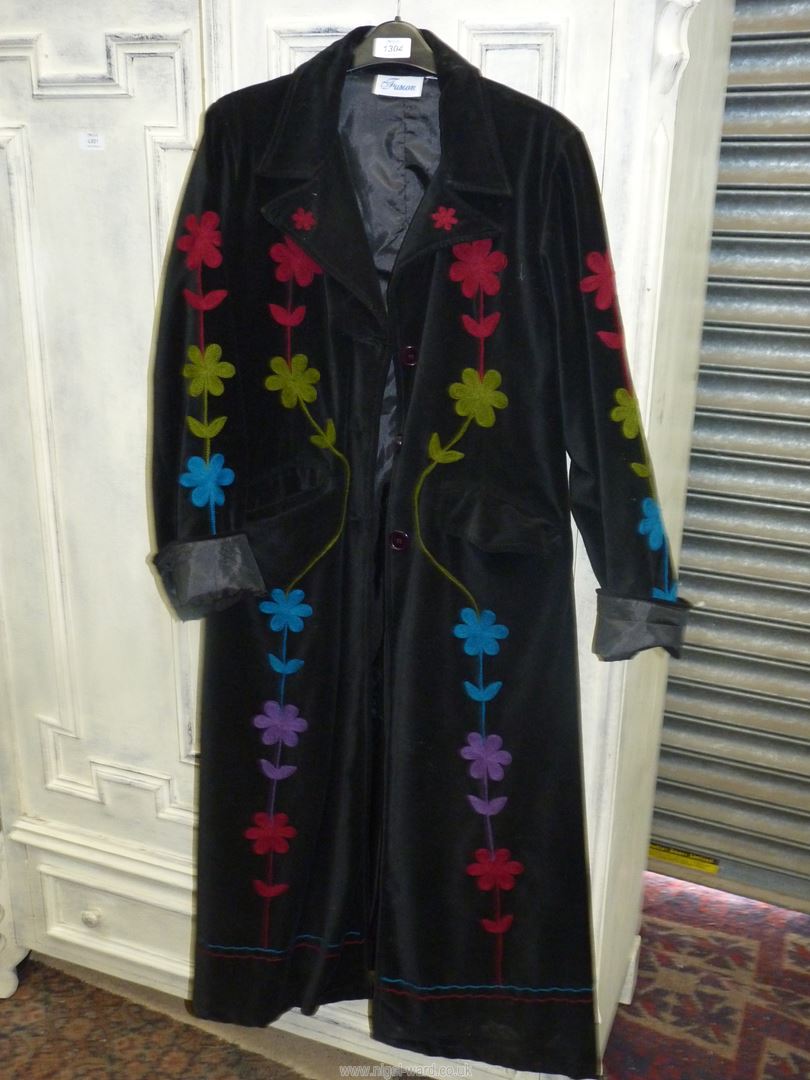 A 'Fusion' ladies full length coat having floral decoration, size M.