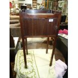 A Georgian Mahogany Campaign bedside/pot cupboard standing on square legs and having a tray type