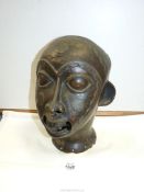 An African bronze male Head, being hollow with cut-outs at the mouth, nose,