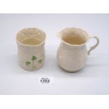 An Irish Belleek creamer and Shamrock vase.